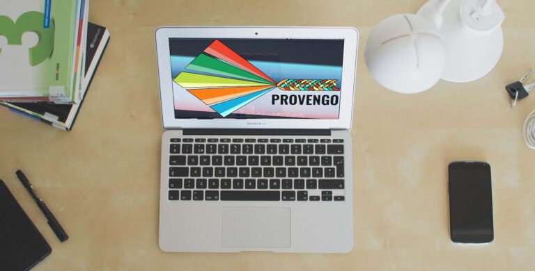 A table with a laptop and a Provengo screen.